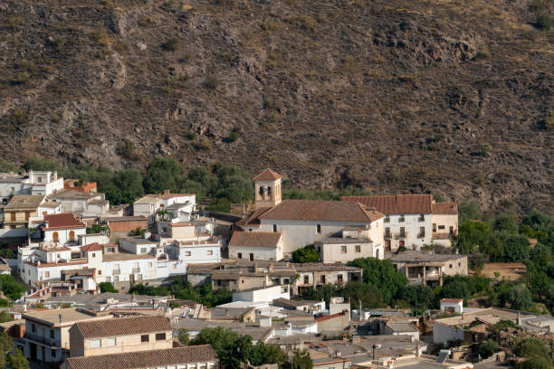 istock small town with white facades and church 1266287900