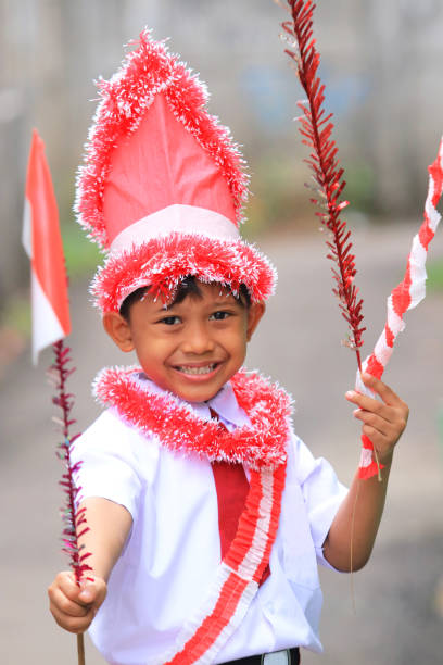 istock An elementary school child carrying an Indonesian flag 1266292519