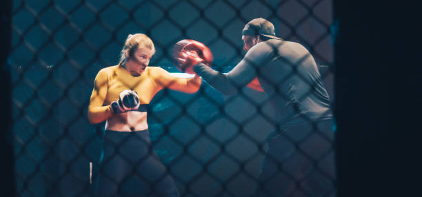 istock Female Boxer pad work session with trainer. Quick punch and dodge 1266293002