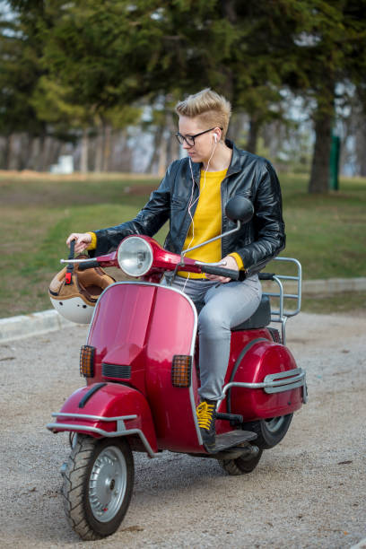 istock Urban girl on a scooter 1266293028