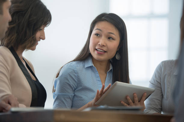istock Businesspeople discussing with each other 1266299338