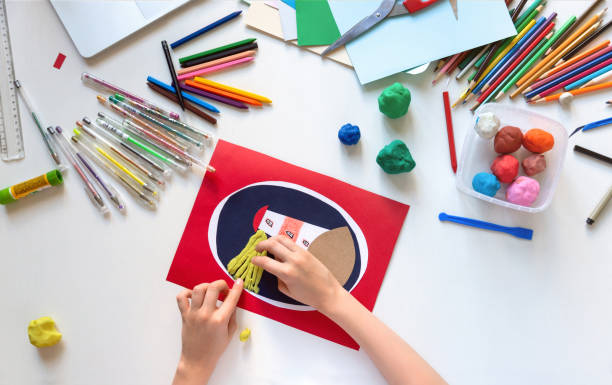 istock Child getting creative card with plasticine. Kids crafts. Top view. 1266299446