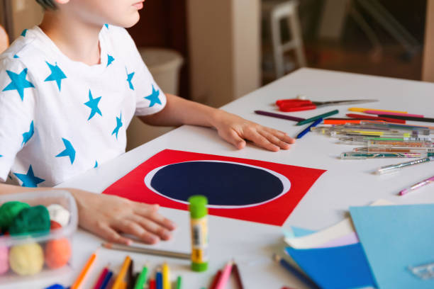 istock Child making hand made card. Kids art and crafts. 1266299535