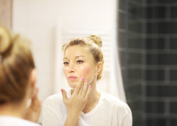 istock Magic anti-aging cream.Applying the cream 1266300329