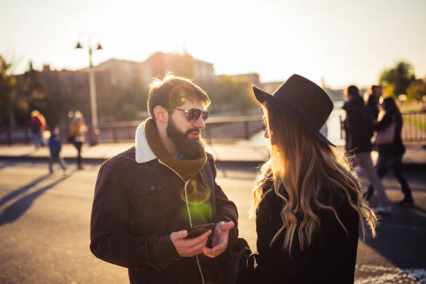 istock Young couple discussing on the street 1266300458