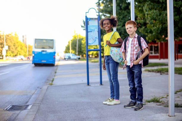 istock Children waiting on a bus stop 1266300461