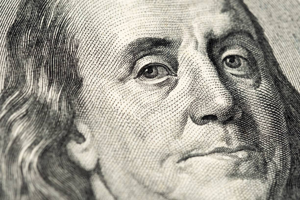 istock Benjamin Franklin's portrait on one hundred (100) american dollar bill. Macro close up view. 1266300547