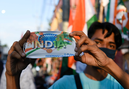 Vendor selling tricolour or Indian flag on the street in the eve of Independence day, amid coronavirus pandemic in Guwahati, Assam, India on Friday, 14 August 2020.