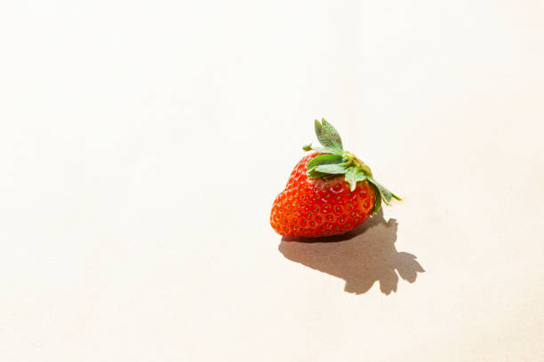 istock Fresh strawberry in a bowl on light gray concrete background 1266307772