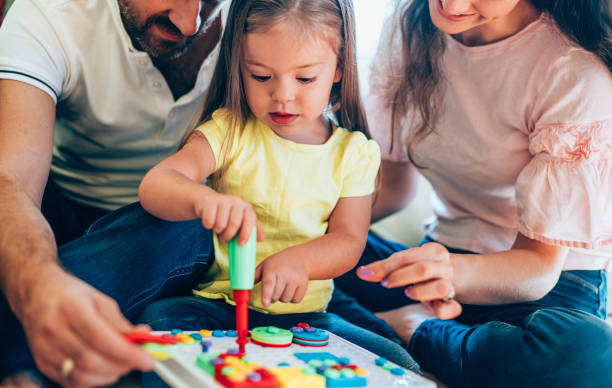 istock Happy family having fun time at home 1266308443