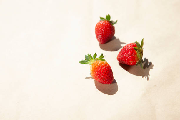 istock Fresh strawberry in a bowl on light gray concrete background 1266308532