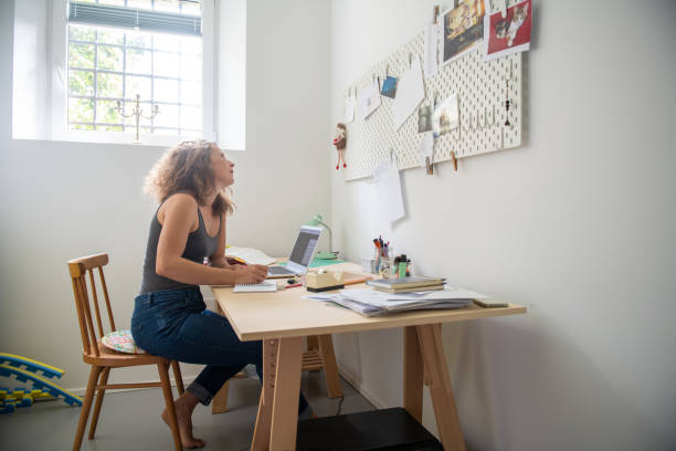 istock Young woman working from home 1266308810