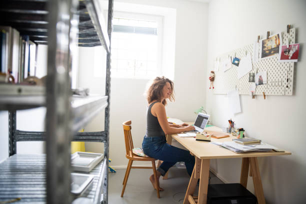 istock Young woman working from home 1266309583