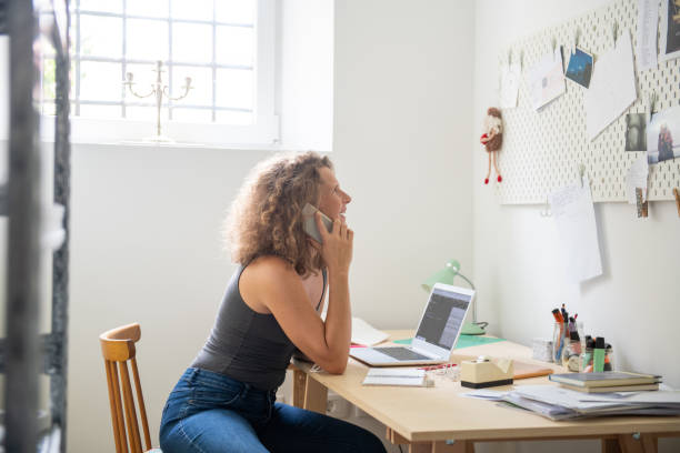 istock Young woman working from home 1266310308