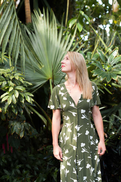 istock Blond girl in a botanical garden 1266313587