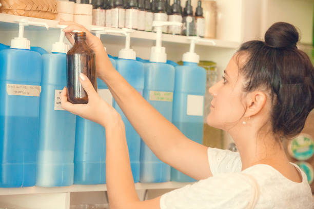 istock Containers with natural biodegradable household chemicals in zero waste plastic free store. Dispensers for detergents, shampoo, soap, conditioner. Sustainable alternative shopping and lifestyle 1266314014
