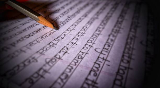 istock schoolgirl writing with pencil 1266314689