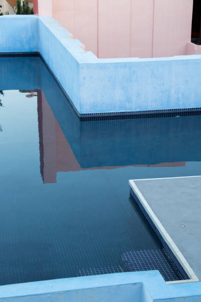 istock Luxury swiming pool with trees in a beautiful sunrise 1266314850