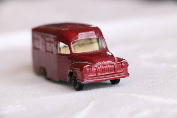 istock Red toy van on a white cloth. 1266315098