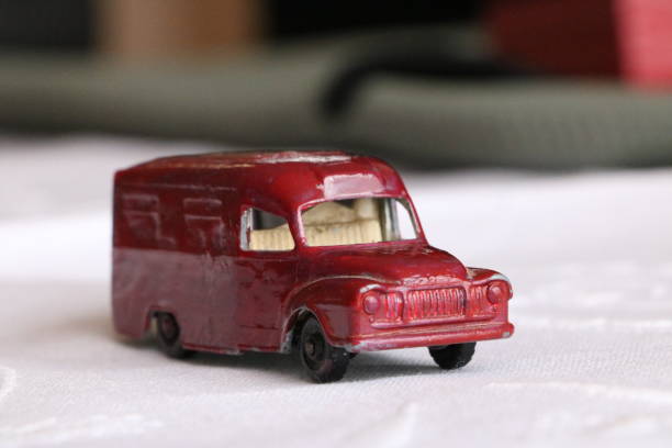 istock Red toy van on a white cloth. 1266315103