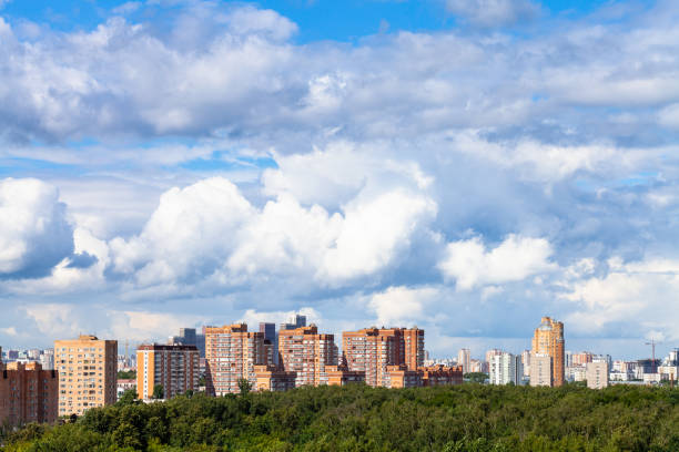 istock large white clouds over city and park in summer 1266316246