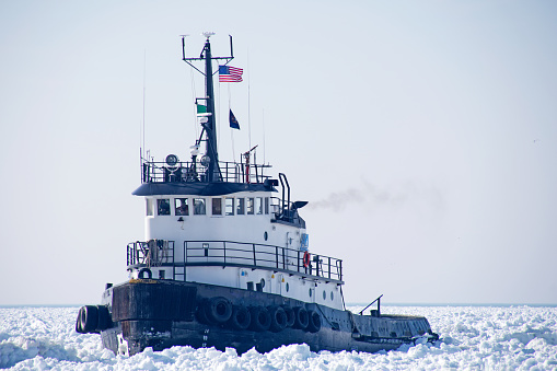Old tugboat in Lake Michigan ice.