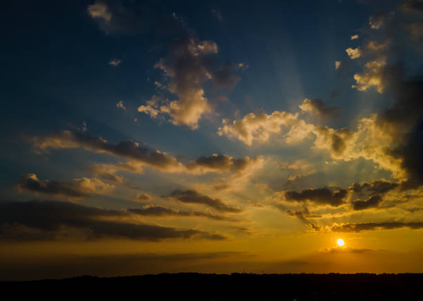 istock Colorful sunset bright horizon burning skies with clouds 1266317452