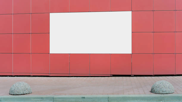 istock big empty banner with white mock-up on red wall over sidewalk 1266318369