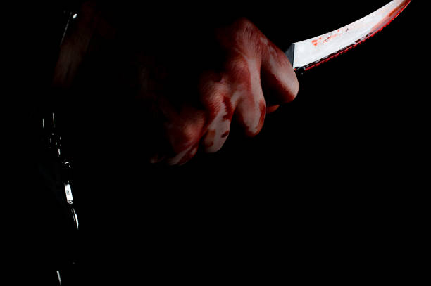 istock Bloody Hand Knife 1266318995