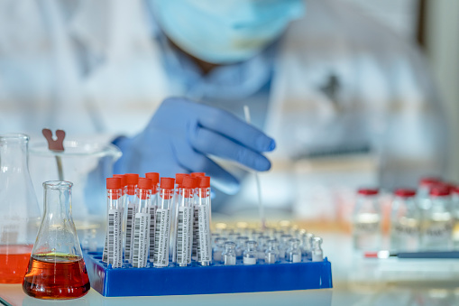 A male in his 30s of Indian ethnicity, working in a scientific laboratory searching for a vaccine for COVID-19.