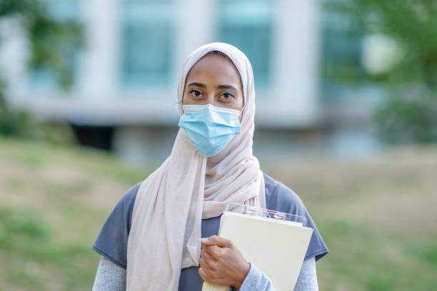 istock Beautiful Muslim Doctor Standing Outside 1266322813