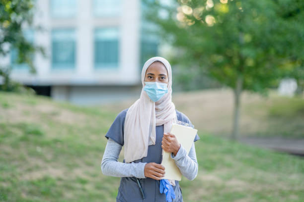 istock Beautiful Muslim Doctor Standing Outside 1266322822