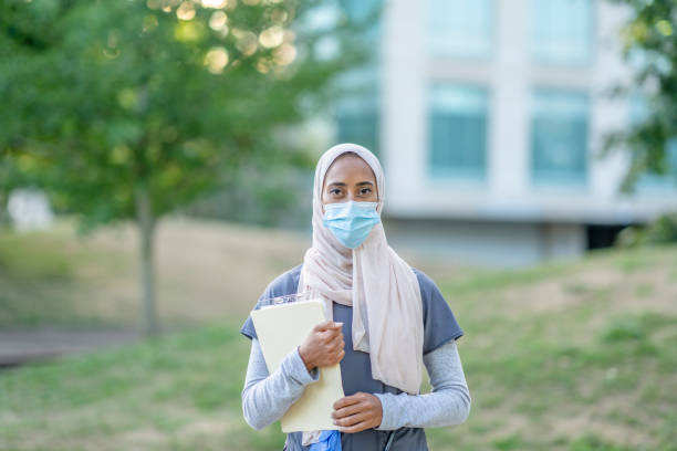 istock Beautiful Muslim Doctor Standing Outside 1266322836