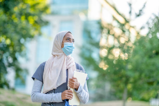 istock Beautiful Muslim Doctor Standing Outside 1266322839