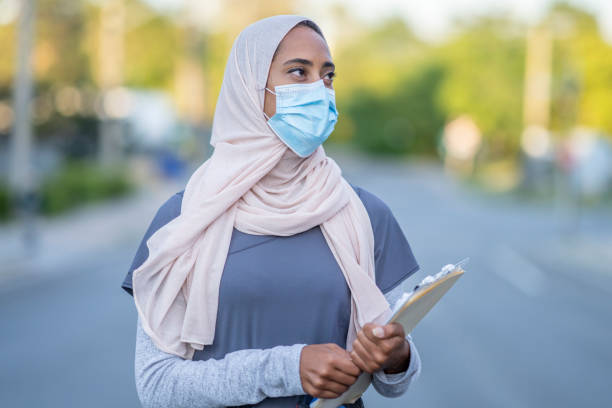 istock Beautiful Muslim Doctor Standing Outside 1266322843