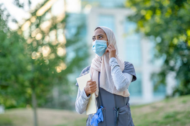 istock Beautiful Muslim Doctor Standing Outside 1266322846