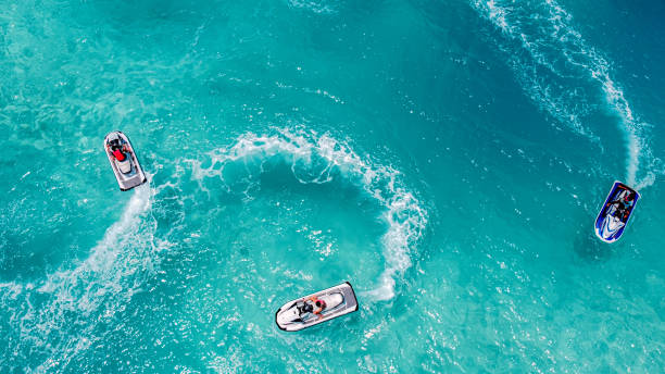 Jet Ski, Tropical Ocean Aerial view Aerial view of Jet Ski, Tropical Ocean Maldives island summer vacation water sport stock pictures, royalty-free photos & images