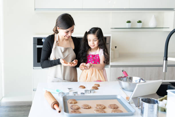 istock Family Making Cookies Together At Home 1266328817