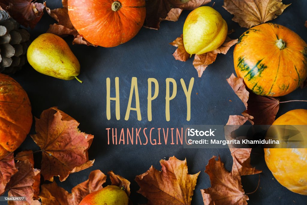 Frame made of pumpkins, pears and autumn leaves with happy thanksgiving text. Thanksgiving day background. Holiday banner. Thanksgiving - Holiday Stock Photo