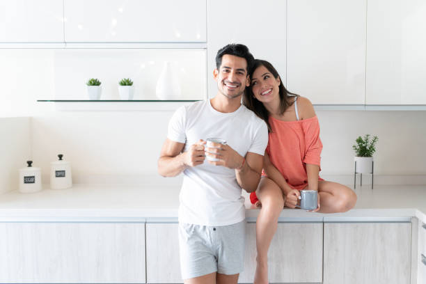 istock Happy Latin Couple In Kitchen At Home 1266331120