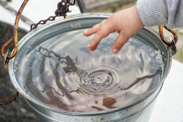 istock Take water from the well with a bucket 1266331349