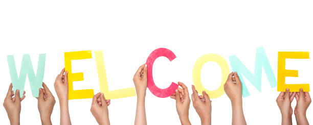 istock word welcome concept with people holding colorful alphabets 1266334355