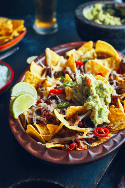 istock Nachos with Minced Meat, Hot Salsa and Guacamole 1266334724