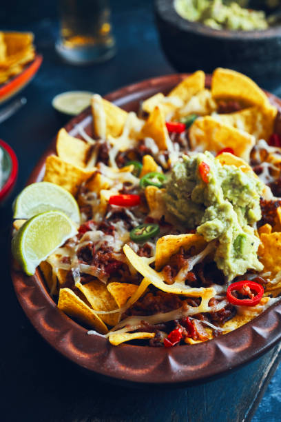 istock Nachos with Minced Meat, Hot Salsa and Guacamole 1266334741