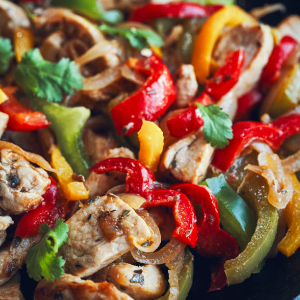 Fajitas de Pollo Chicken marinated Tortillas with Onions and Peppers