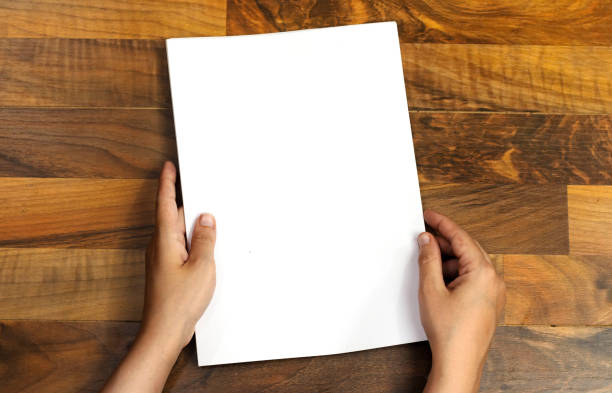 closeup woman hands holding a blank papers, billboard