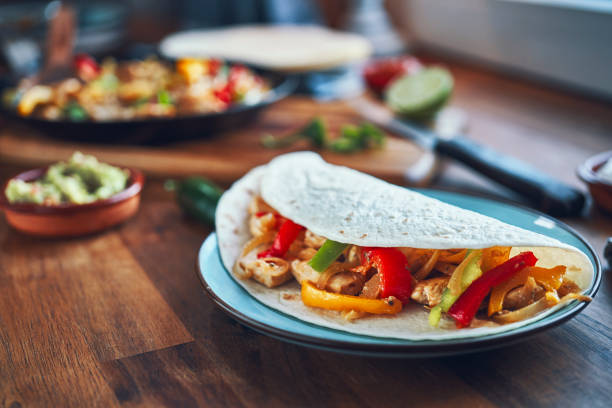 Fajitas de Pollo Chicken marinated Tortillas with Onions and Peppers