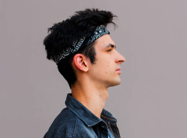 istock Side view of young man isolated on gray background 1266336615