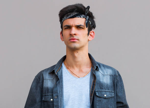 istock European man showing I don't know gesture, arms out asking why what's the problem who cares. Negative human emotion facial expression feelings 1266336624
