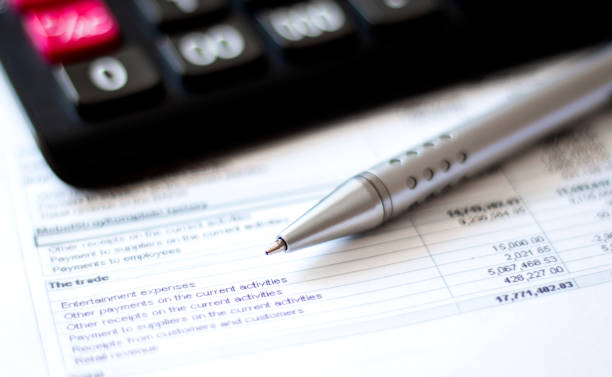 istock Calculator and pen on diagram chart background 1266338590